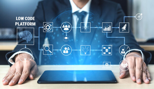 Businessman Using Low Code Platform with Digital Interface Illustrating Technology Solutions and Workflow Concepts for Modern Enterprises Quark.
