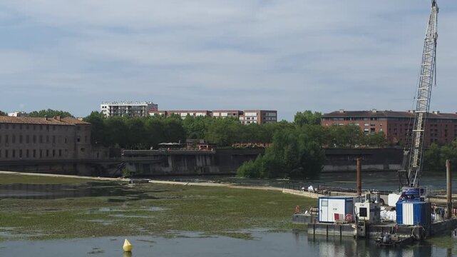 Historic La Grave Hospital and Garonne River Waterfront in Toulouse, France