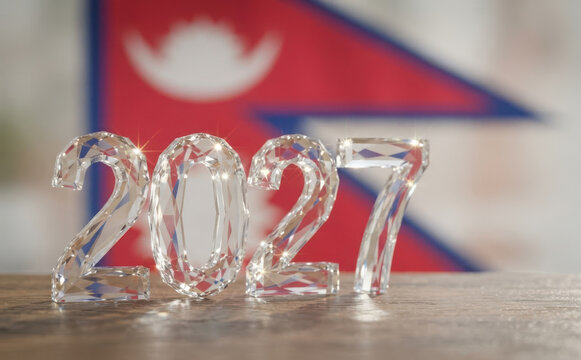 Sparkling crystal 2027 numbers standing on a wooden surface with the flag of Nepal in the background