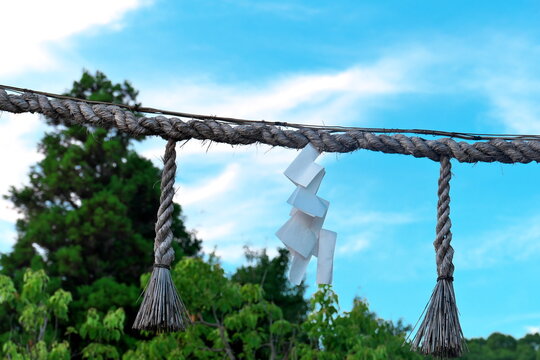 Shimenawa ritual rope with shide paper streamers in Japan