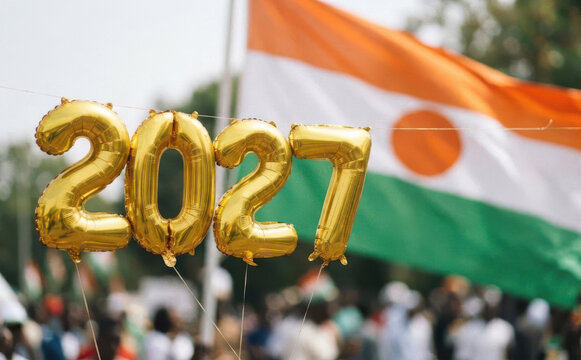 Golden 2027 balloons against a national flag background representing future celebrations and events