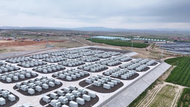 Aerial view of large outdoor energy storage battery array facility