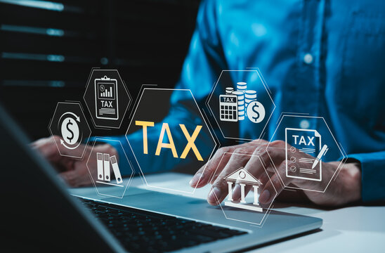 Digital tax management concept. Businessman typing on laptop with financial icons such as tax document, Income tax, calculation, deadlines and government filing, representing online taxation solutions