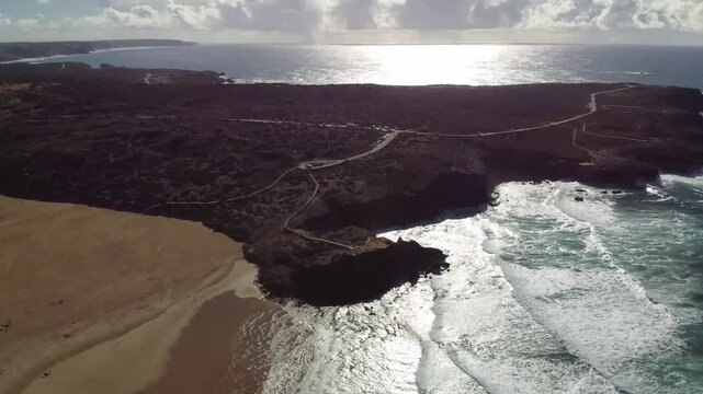 Aerial view of river mouth and Atlantic coast at Praia da Bordeira, Portugal