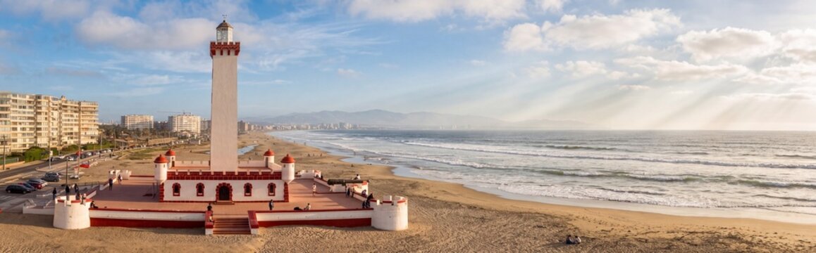 La serena lighthouse, iconic landmark on chile's pacific coast, guiding ships and offering panoramic beach views
