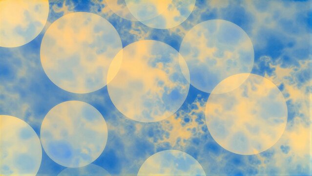 Floating blue and yellow circles overlap in a dreamy, watercolor-like abstract scene.