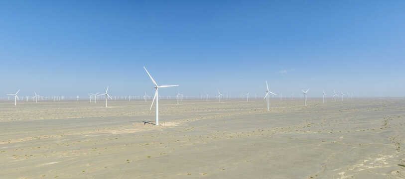Vast Wind Farm Turbine Array Across Gobi Desert Landscape
