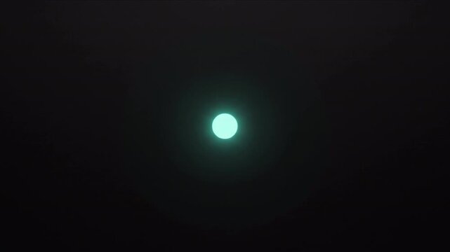 黒背景で周囲の光粒子が中心のターコイズコアへと収束統合する幾何学CG動画