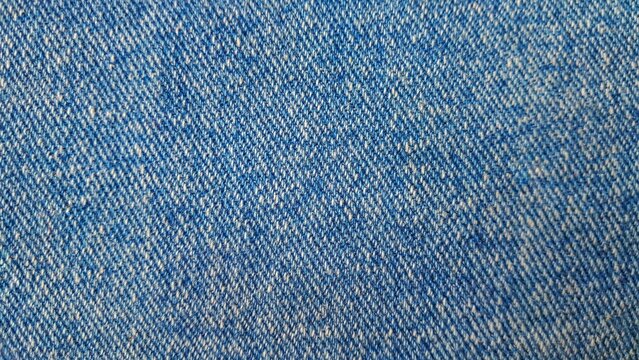 Close-up texture of blue denim jeans fabric background