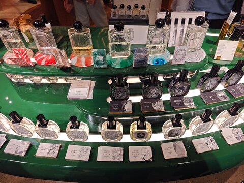 Shanghai,China-Dec.13th 2025: various Diptyque perfume bottles and blotters displayed on counter in store