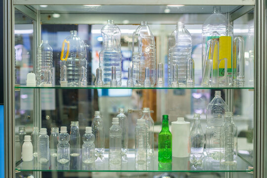 Assorted Plastic Bottles and PET Preforms in Display Cabinet