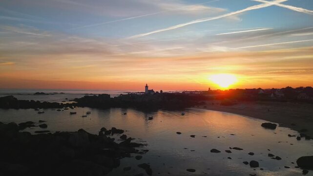 sunrise over lighthouse on a rocky coastline, drone footage. Normandy, France. Travel,tourism and nature footage with copy space