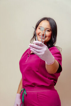 Dentist holding dental tools for oral hygiene