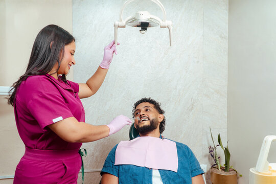 Dentist examining patient during dental care consultation