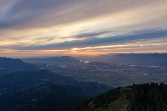 Sunset Over Valley and Layered Mountains From Elk Mountain Near Chilliwack BC Canada