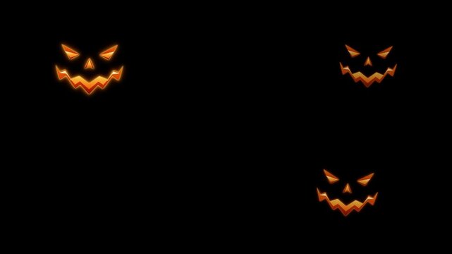Glowing halloween pumpkin faces appearing on a dark background