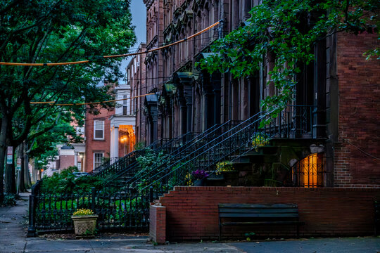 Historic stone church architecture and classic brick townhouses in downtown New Haven Connecticut