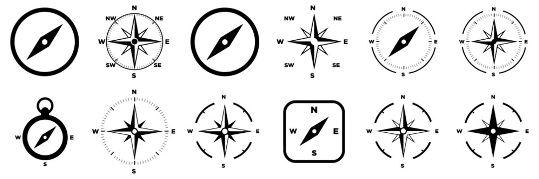 Collection of black and white compass and wind rose symbols for navigation and direction