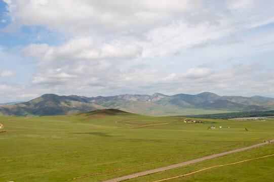Grassland landscape with distant mountain ridges, Tuv Province, Mongolia