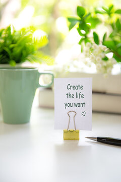 Notebook with create the life you want on notepad inspiring new beginnings and future life planning.  Goal Life Wellness Concept.