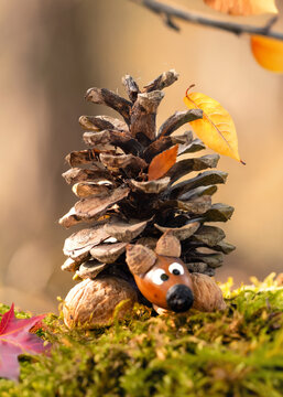 Creative Handmade Autumn Arrangement with Acorns, Nuts and Colorful Leaves