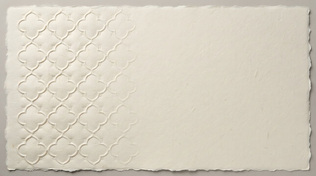 Off-white handmade paper texture with embossed quatrefoil pattern and deckled edges