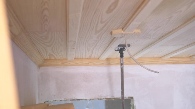 Wooden ceiling installation with adjustable support pole