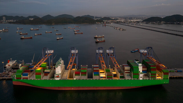 Aerial view of container cargo ship at night, Container cargo ship in global business import export logistic, Logistics and transportation international container cargo ship supply chain.