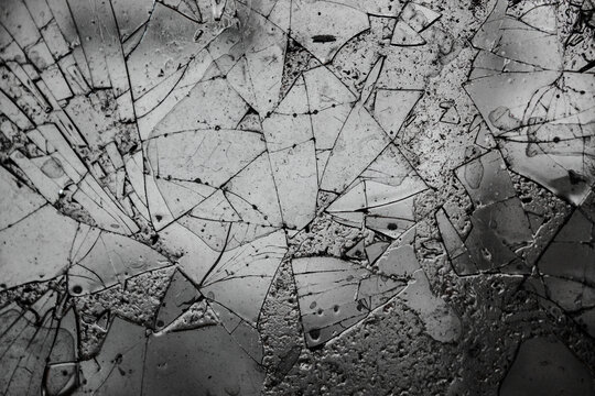 Broken glass texture and background with cracked pattern