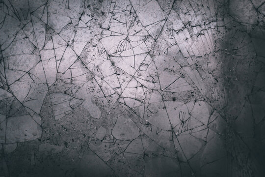 Broken glass texture and background with cracked pattern
