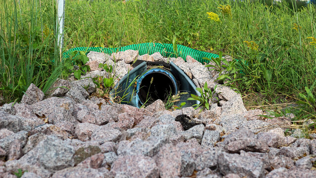 Drainage Culvert Pipe and Silt Sock with Riprap Rock Erosion Control. Environment and Civil Engineering Concepts.