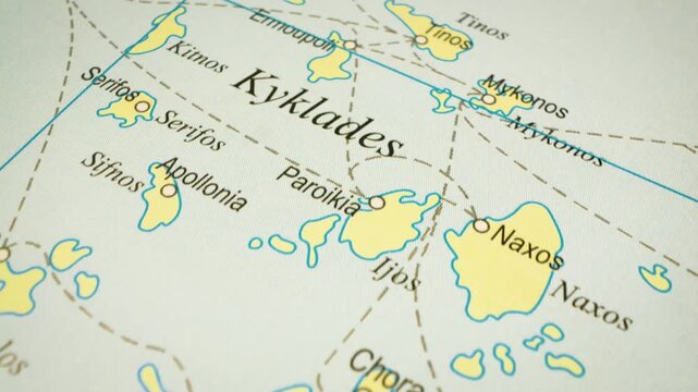 Gliding camera view over the Cyclades Islands, Greece, on detailed map
