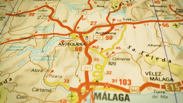 route to malaga, spain &ndash; gliding camera over atlas map