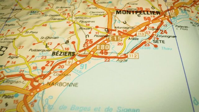 coastal road leading to montpellier, france &ndash; gliding view over atlas map