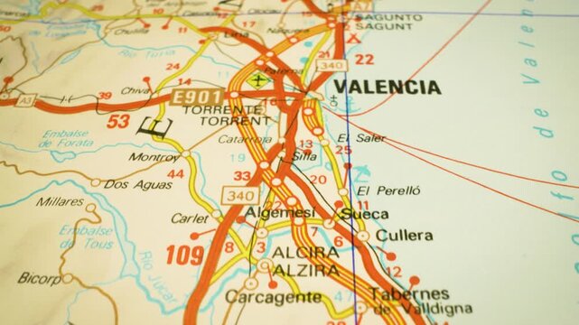 road network leading to valencia, spain &ndash; gliding over atlas map
