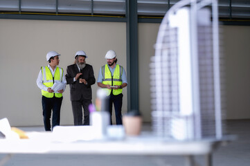 Senior manager visit walking meeting engineering experts, engineer managers reporting skyscraper...