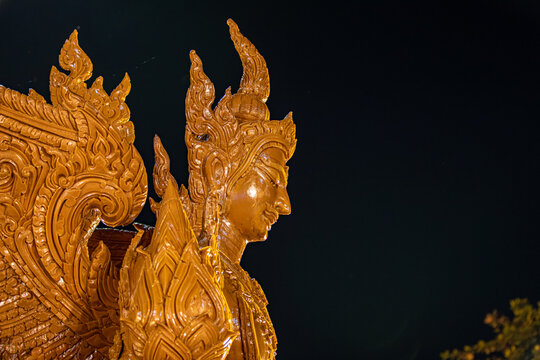 Buddhist Lent tradition, a beautiful display of wisdom, beeswax candles create art as a Buddhist offering.Background with Thai pattern carved on the surface of Lent candle.Ubon Ratchathani.Festival