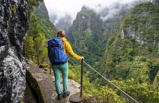 Hiker on a Levada, PR9 Levada do Caldeir&atilde;o Verde, Madeira, Portugal