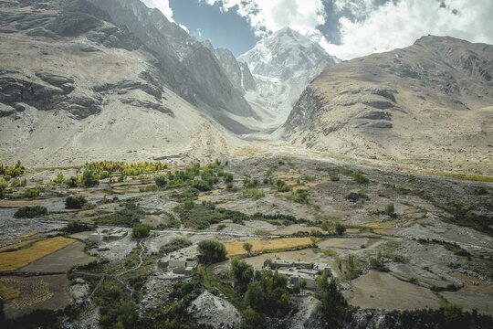 Rural settlement, in the foreground the Wakhan River, in the background snow-covered summit of the Hindu Kush, Wakhan Corridor, Afghanistan
