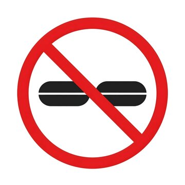 Red prohibition symbol placed over scattered black and white pills and tablets, communicating a medication ban, anti-drug warning, prescription misuse prevention, health safety message
