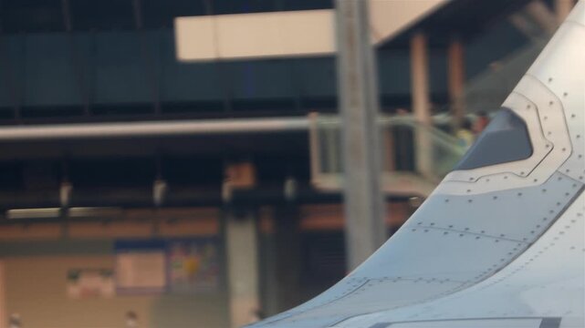 Close-Up Airplane Wing Detail at Airport