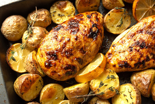 Oven roasted lemon garlic chicken and baby potatoes with herbs