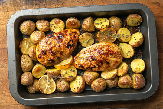Oven roasted lemon garlic chicken and baby potatoes with herbs
