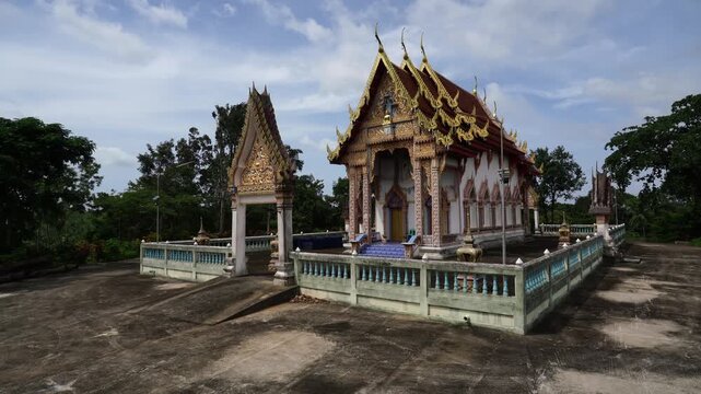 Exterior view of traditional Thai Theravada Buddhist temple pavilion at Wat Nong Khae in the southern province of Chumpon, Thailand