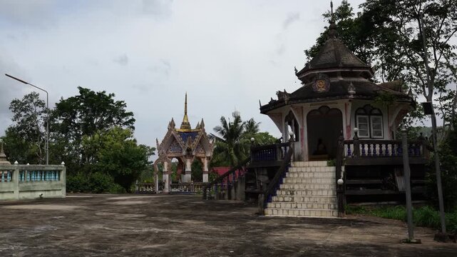 Exterior view of traditional Thai Theravada Buddhist temple pavilion at Wat Nong Khae in the southern province of Chumpon, Thailand