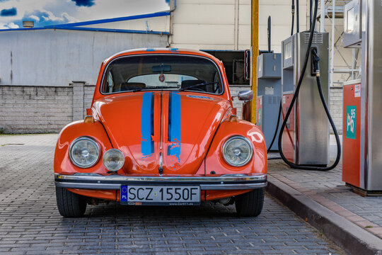 Czestochowa, Poland - September 12, 2026 Classic Volkswagen Beetle with Gulf racing livery at a petrol station
