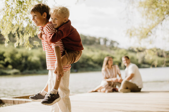 Joyful lake moments with kids playing and family bonding