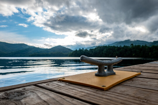 Boat dock cleat with mountain lake view and dramatic sky Lake Santeetlah North Carolina