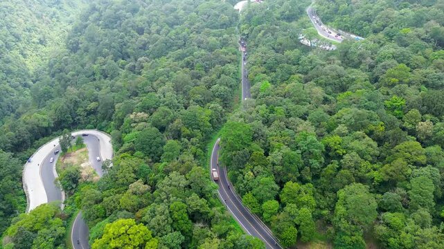 Winding Forest Road and Green Mountain Landscape in North Sumatra