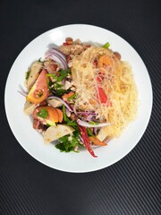 Spicy Glass Noodle Salad Yum Woon Sen With Pork Sausage And Shrimps In White Ceramic Plate © wilasinee